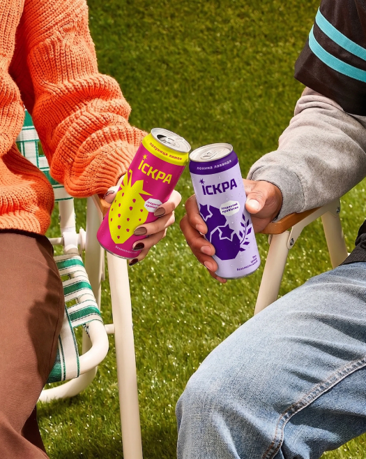 People Holding Cans